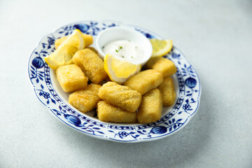Traditional homemade fish croquettes with sauce