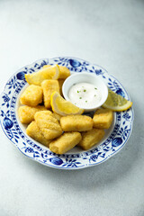 Traditional homemade fish croquettes with sauce