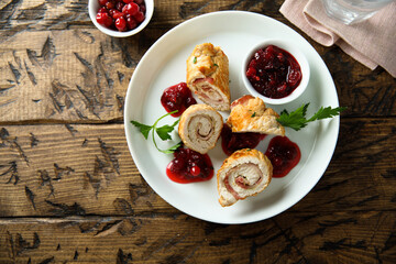 Homemade chicken rolls with cranberry sauce