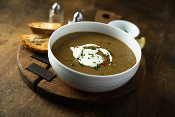 Homemade creamy lentil soup with herbs
