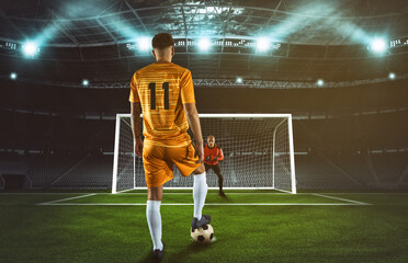 Soccer scene at night match with player in yellow uniform kicking the penalty kick - obrazy, fototapety, plakaty