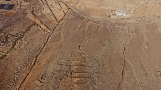 Aerial drone flight through a valley on Fuerteventura