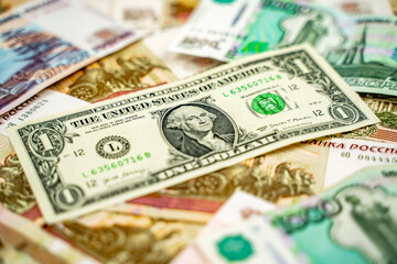 Russian and American paper money. Rubles and US dollars exchange rate.