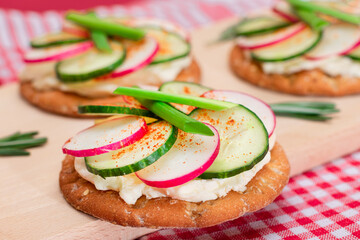 Light Breakfast or Diet Eating - Crispy Cracker Sandwich with Cream Cheese, Fresh Cucumber, Green...