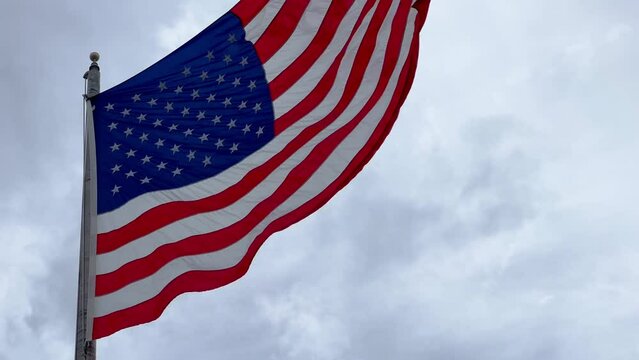Huge Flag of the United States waving in the wind - travel photography
