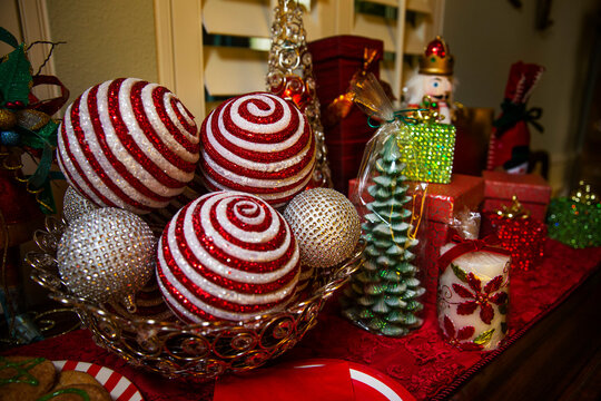 Detail of dining room table decorated for festive Christmas party with cookies and decorations