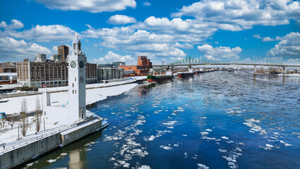 Ship waiting at Montreal Port with Jacques Cartier Bridge in background