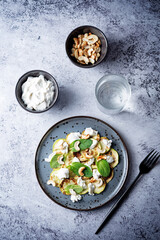 Zucchini ricotta cashew mint salad in a plate