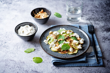 Zucchini ricotta cashew mint salad in a plate