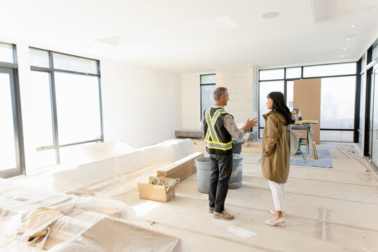 Engineer And Architect Meeting In House Under Construction