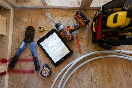 View from above construction tools and digital tablet