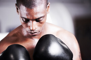 Visualizing success. A young boxer taking some time to visualize before a fight.