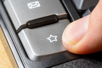 Finger pressing a star symbol icon button, man clicking the favorite bookmark key, liking, adding...