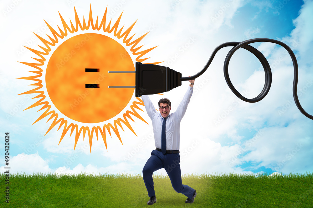 Wall mural businessman in solar energy concept