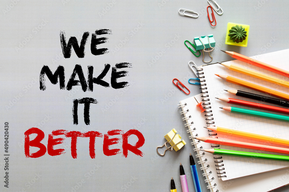 Aufkleber practice makes better text written on a notebook with pencils.