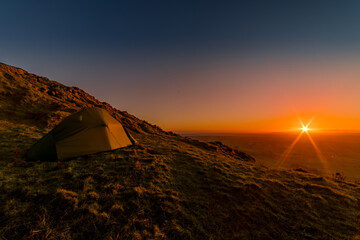 Fototapeta na wymiar Wild camping sunset and nightscape images on Slemish Mountain, Ballymena, County Antrim, Northern Ireland