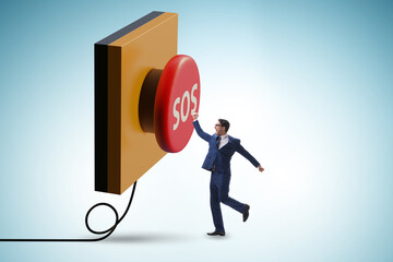 Businessman pressing SOS button in case of danger