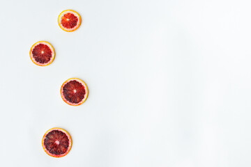 bright blood orange slices in white background citrus circle concept