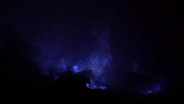 Blue fire burning inside the crater of Kawah Ijen volcano in East Java, Indonesia. 