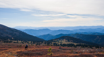 equestrian trip in the Altai mountains, descent from the mountain on horseback