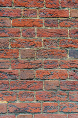 brick wall of red textured brick.