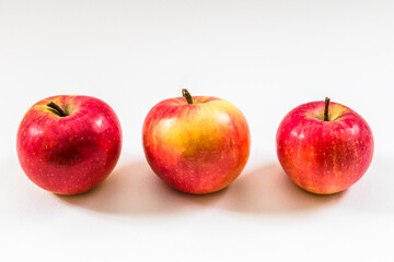 ripe apples on white background close up