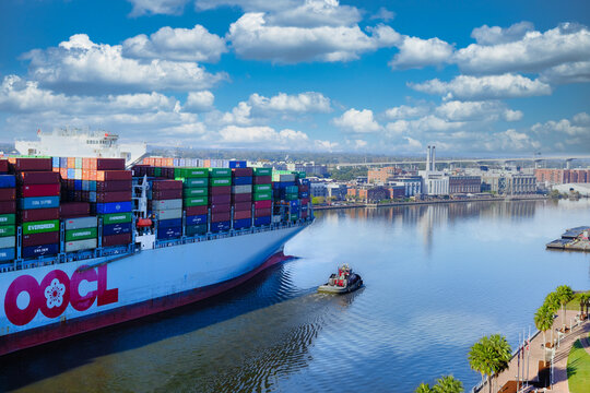 Tugboat with OOCL Freighter in Savannah