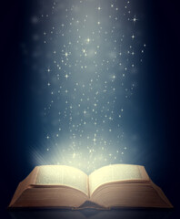 Be drawn into new worlds. Shot of an open storybook with light emanating from it.