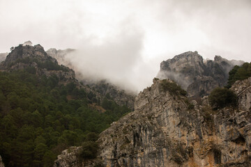 Fototapeta na wymiar Mountain trails in the mist during winter time