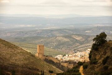Fototapeta na wymiar Aerial view of Cazorla stone town in the province of Jaén, Andalusia on a background of olive tree plantations on the hills