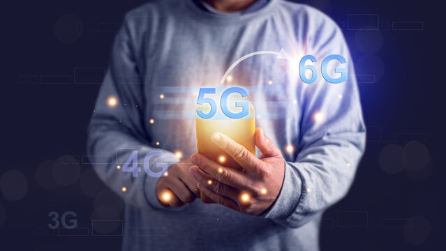 Businessman using smartphone to using social media and world wide communication with 5G technology. Network technology advances 3G 4G 5G and 6G. network connection in the future.