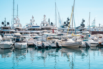 Boats on a Monaco yacht show moored in harbour