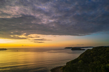 Aerial sunrise seascape with  low clouds