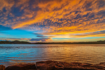 Fototapeta na wymiar Sunrise by the bay with cumulonimbus clouds