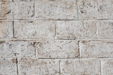 Wall background from white blocks with old texture.