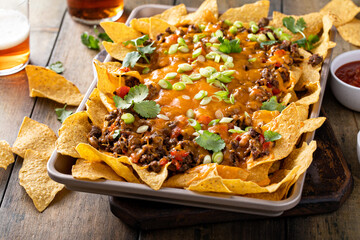 Traditional nachos with ground beef and red pepper