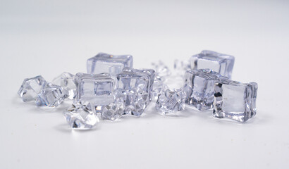 ice cubes with reflection against white background