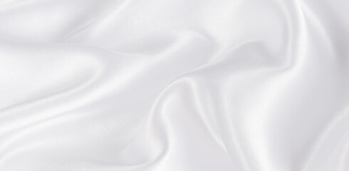 Abstract white silk fabric texture background.  Creases of satin