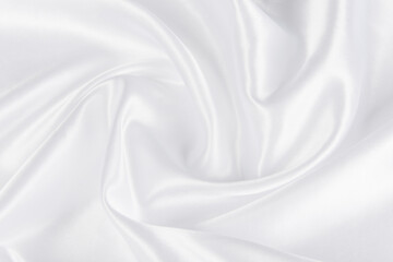 Obraz premium Abstract white silk fabric texture background. Creases of satin