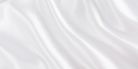 Fototapeta na wymiar Abstract white silk fabric texture background. Creases of satin