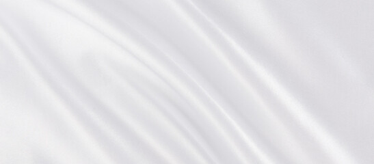 Obraz na płótnie Canvas Abstract white silk fabric texture background. Creases of satin