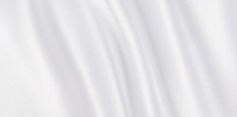 Abstract white silk fabric texture background.  Creases of satin