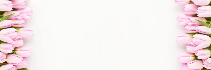 Pink tulips border on a white background. Mothers Day, Valentines Day, birthday concept. Banner