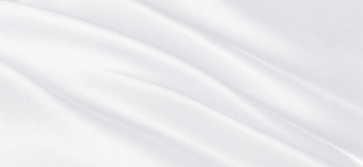 Fototapeta na wymiar Abstract white silk fabric texture background. Creases of satin