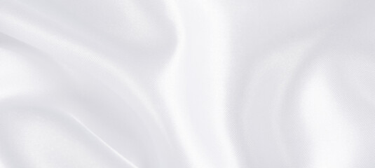 Abstract white silk fabric texture background.  Creases of satin