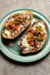 Molletes with fresh sauce and cheese. Mexican food