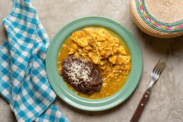 Scrambled eggs with red sauce and beans. Mexican food