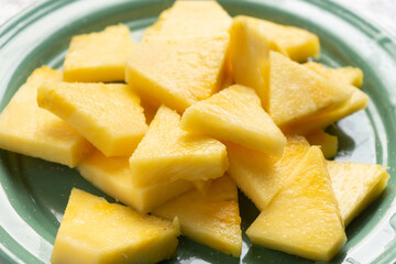 Cutted pineapple fruit on marble background
