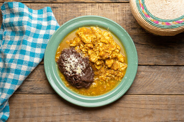 Scrambled eggs with red sauce and beans. Mexican food