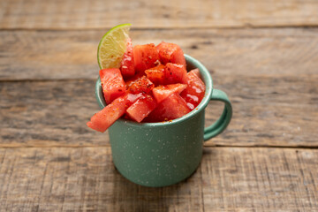Watermelon with chili powder and chamoy. Mexican food